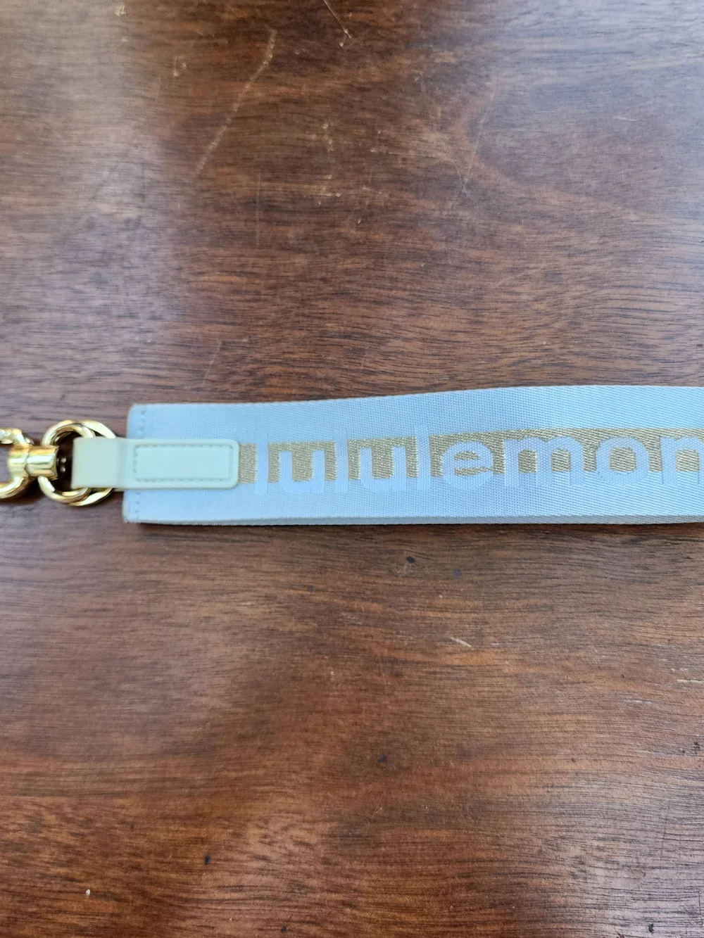 Lululemon Never Lost Keychain Metallic Wordmark Blue Gold NWOT